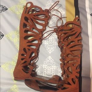 Lace up gladiator flat sandals.